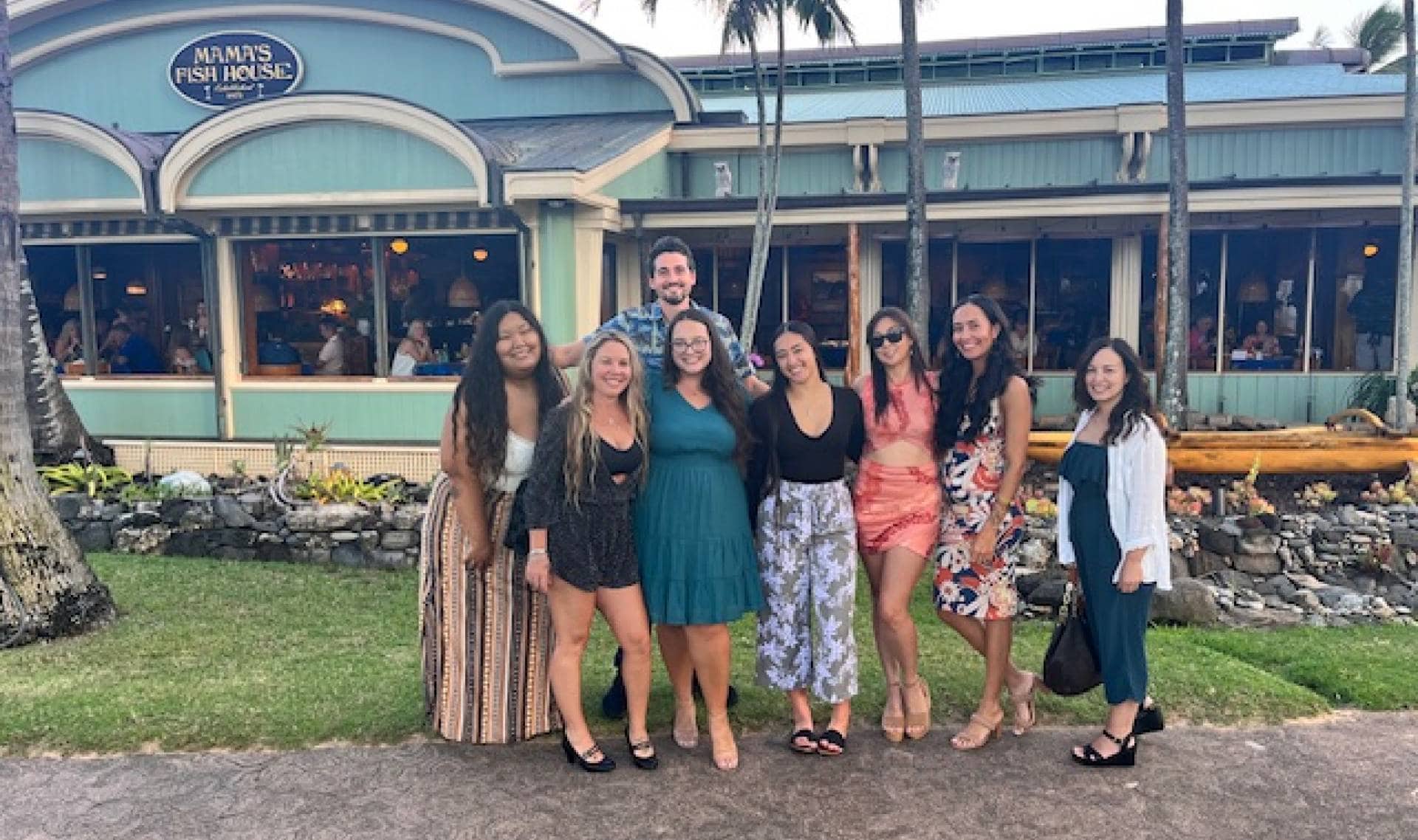 The orthodontic team smiling and posing outside of Mama's Fish House Restaurant